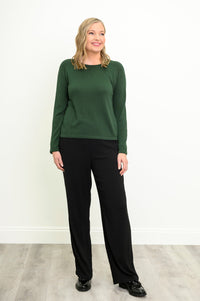 Front view of a vibrant deep moss pullover and slim black pants, highlighting a comfortable, relaxed drape.