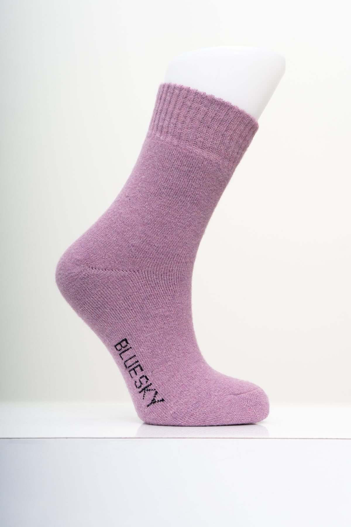 Soft mauve purple knit crew sock displayed on a mannequin foot with a clean, minimal white background.