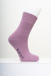 Soft mauve purple knit crew sock displayed on a mannequin foot with a clean, minimal white background.