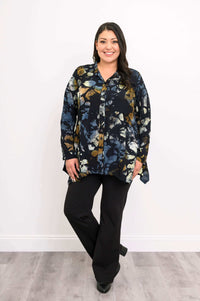 Front view of woman standing in Laney Blouse Night Bloom, arm relaxed
