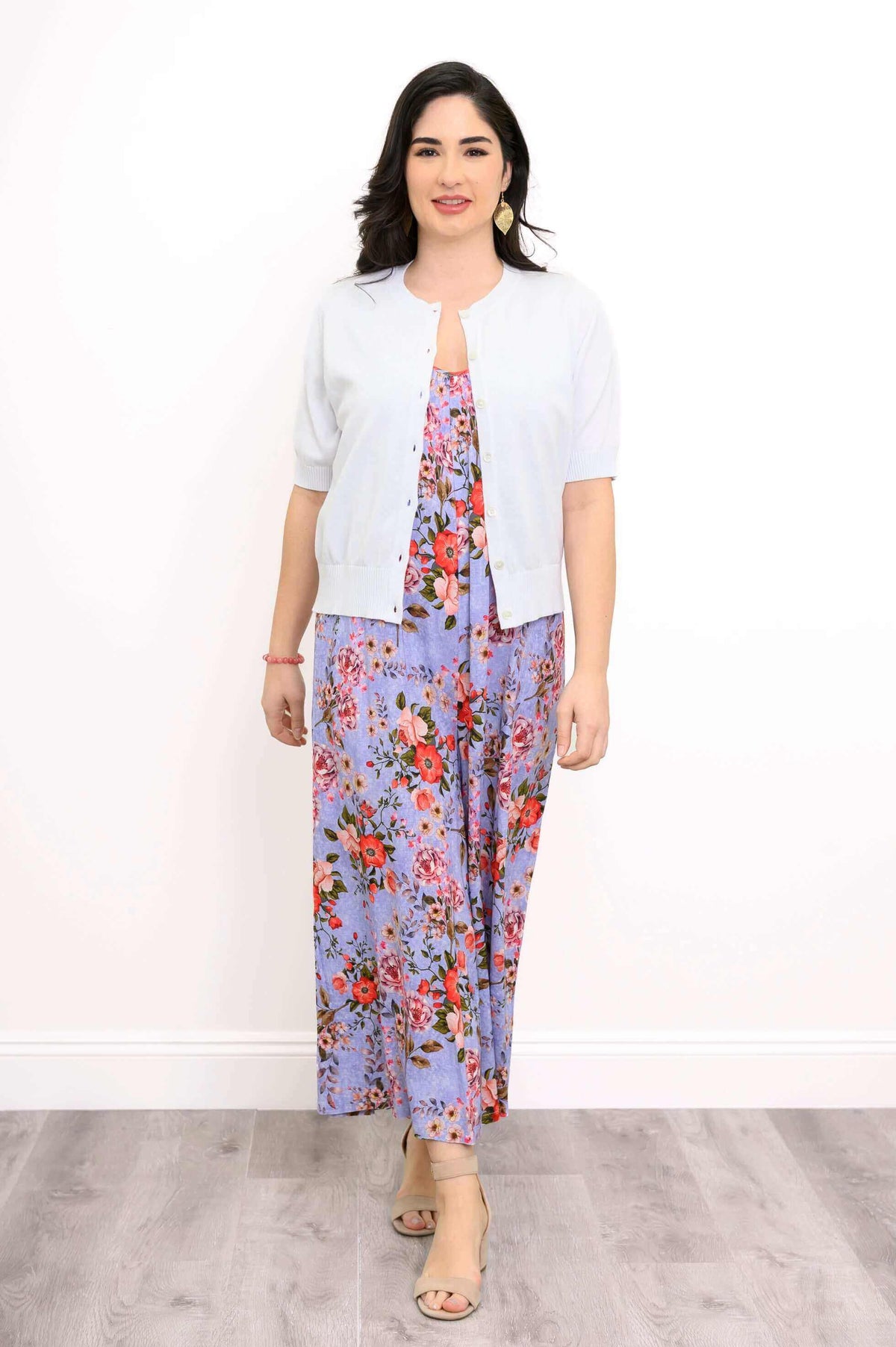 Woman in lavender floral maxi dress paired with a buttoned short-sleeve cardigan