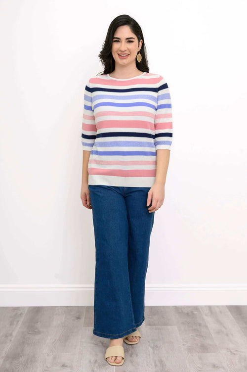 Front view of Louisa Sweater with multi-colored stripes and blue denim pants