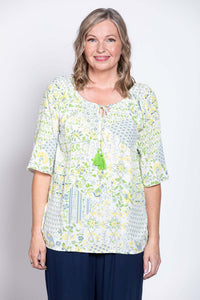 Front view of woman wearing Luna Boho Peasant Top with floral pattern
