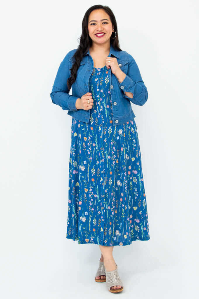 Model wearing Madison maxi dress with a denim jacket in blue wildflower print