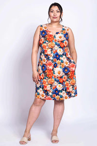 Model wearing Maggie Shift Dress, angled front view with vibrant flowers