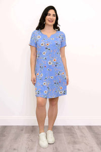 Woman modeling blue floral Maggie shift dress with white sneakers, full frontal