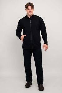 Man in black bamboo jacket, facing front with one hand in pocket