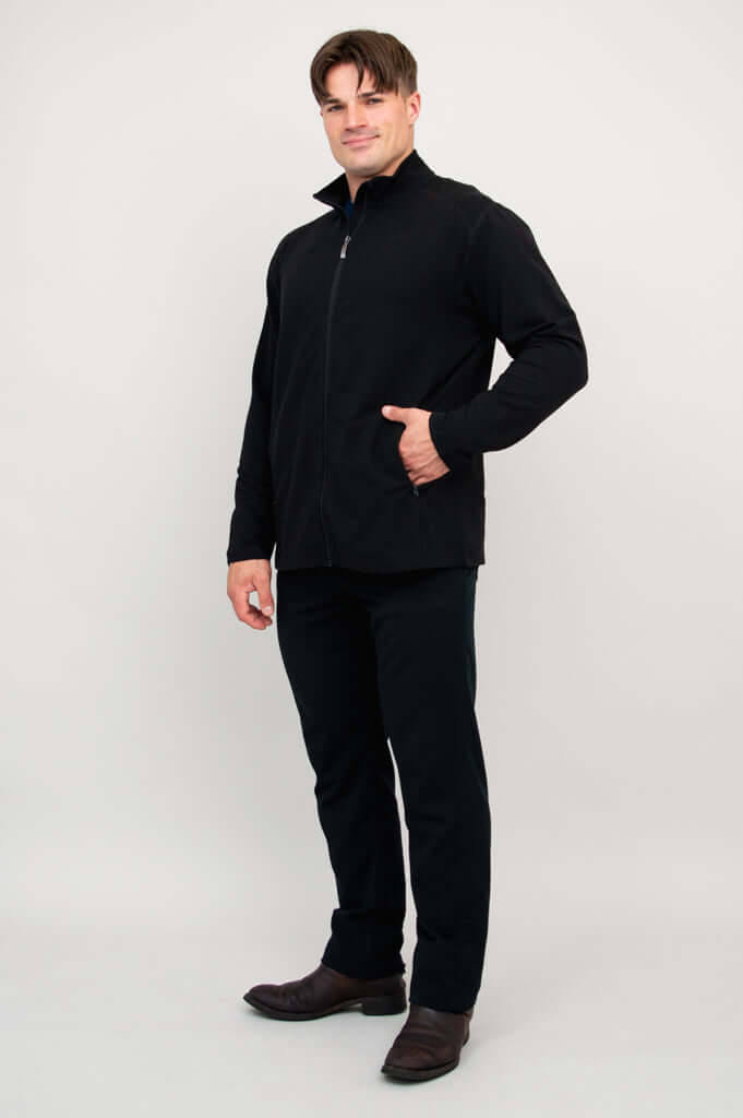 Man posing in black full-zip bamboo fleece jacket, angled to side