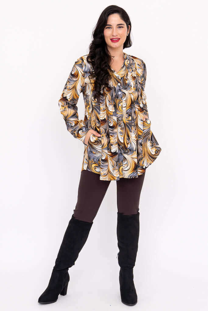 Margate swirl blouse shown with hands in pockets, styled with leggings and boots