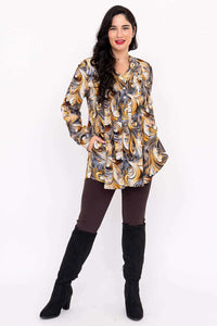 Margate swirl blouse shown with hands in pockets, styled with leggings and boots