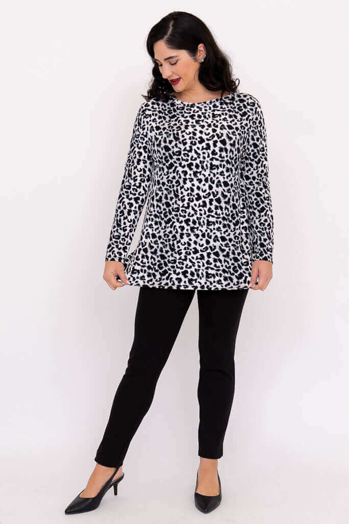 Woman showcasing Margie leopard print long sleeve top and black pants