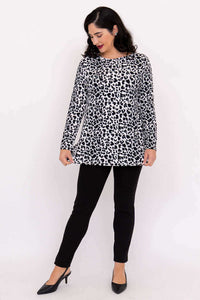 Woman showcasing Margie leopard print long sleeve top and black pants