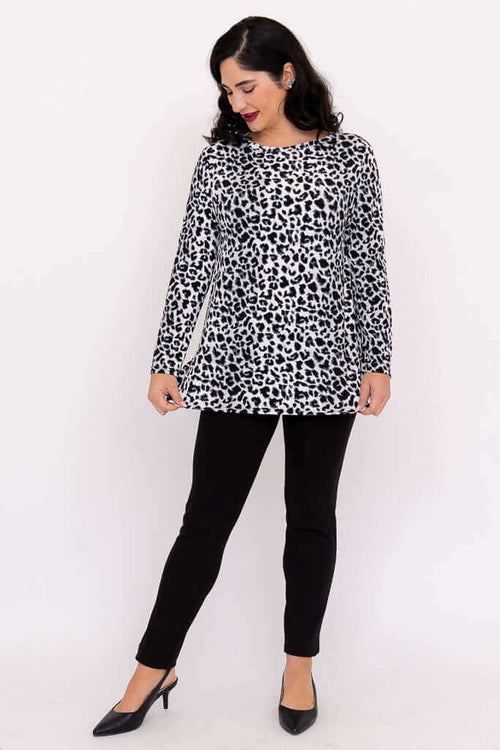 Woman showcasing Margie leopard print long sleeve top and black pants