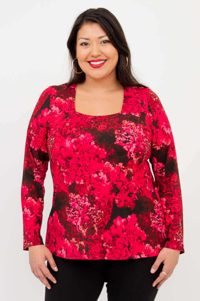 Woman wearing Marissa tunic in Crimson Bloom with square neckline and long sleeves