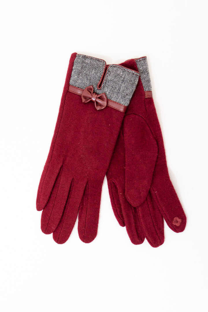 Pair of maroon wool gloves with tweed cuffs and a decorative bow detail