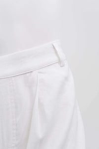 Close-up of Melodie Pant waistband and pleat detail in white linen blend