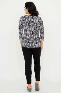 Back view of model wearing Mia Top in Black Feather with black pants