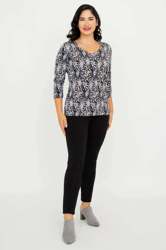 Full body front view of model wearing Mia Top in Black Feather and black pants