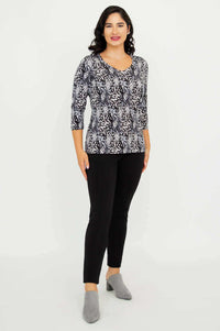 Full body front view of model wearing Mia Top in Black Feather and black pants
