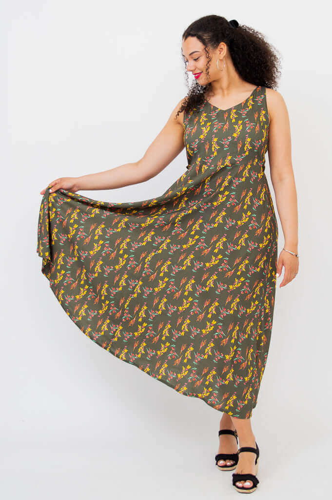 Model showcasing the flowing skirt of the Coraline floral maxi dress