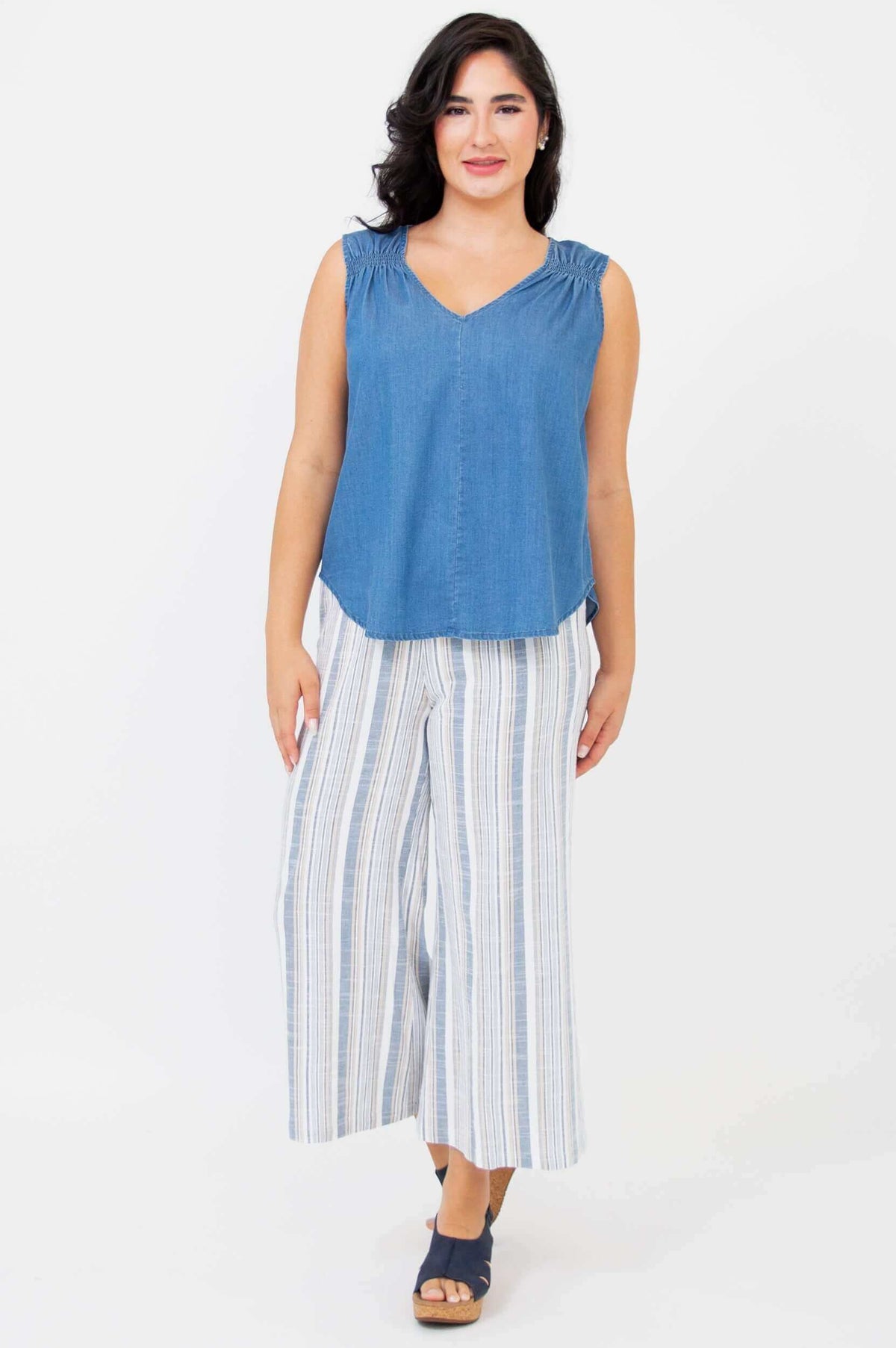 Model front-facing in Landon cropped capris with blue sleeveless top