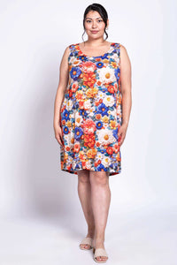 Model front-facing in a colorful floral shift dress with relaxed fit