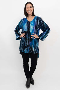 Full body front view of model in Darla blouse with hands on hips and black pants