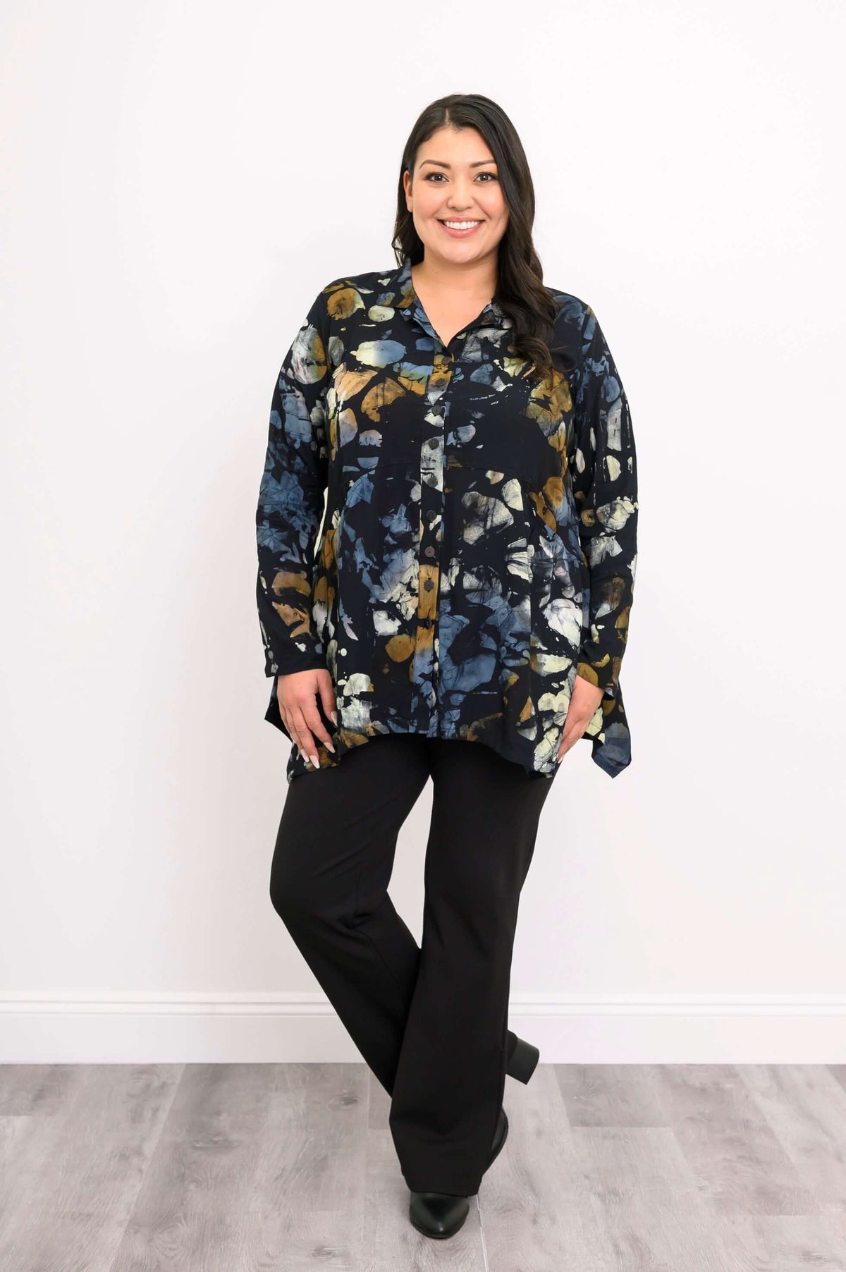 Model posing in Laney Blouse, hands relaxed, showing flowy hemline