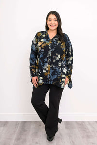 Model posing in Laney Blouse, hands relaxed, showing flowy hemline