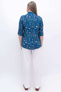 Model wearing Melodie Pant in white linen blend, back view