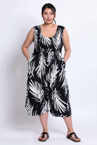 Model in Springbok jumpsuit, facing forward with hands in pockets