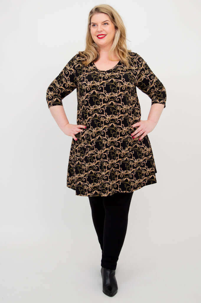 Model posing in Veronica A-Line Tunic with hands on hips, Baroque Black