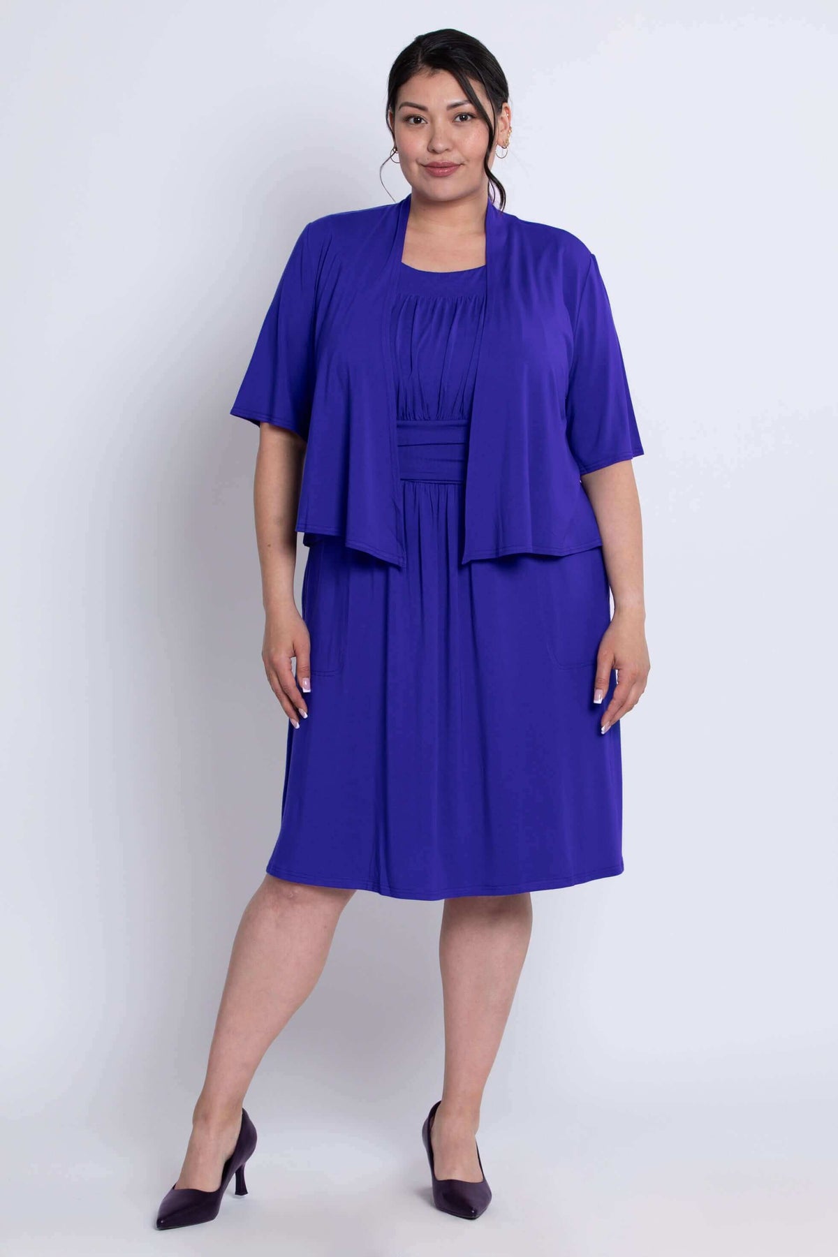 Model in royal blue knee-length dress with matching short sleeve cover-up