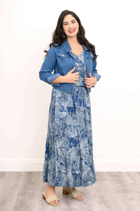 Model in blue floral tank and skirt styled with a denim jacket