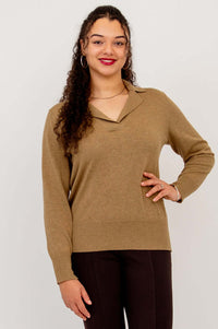 Model wearing brown V-neck cotton sweater with collar, hand on hip
