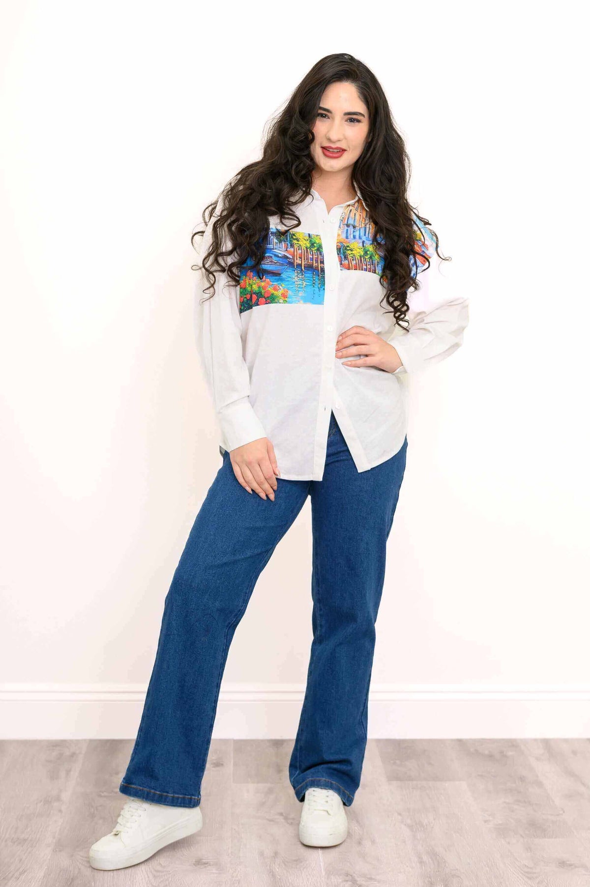 Full view of model in Alex Blouse and jeans, showcasing relaxed fit and artistic design