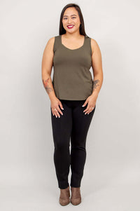 Model in olive bamboo tank top and black pants, facing forward