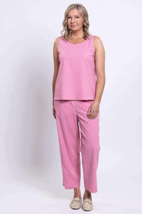 Model standing in pink Boardwalk Pants and coordinating sleeveless top, front view