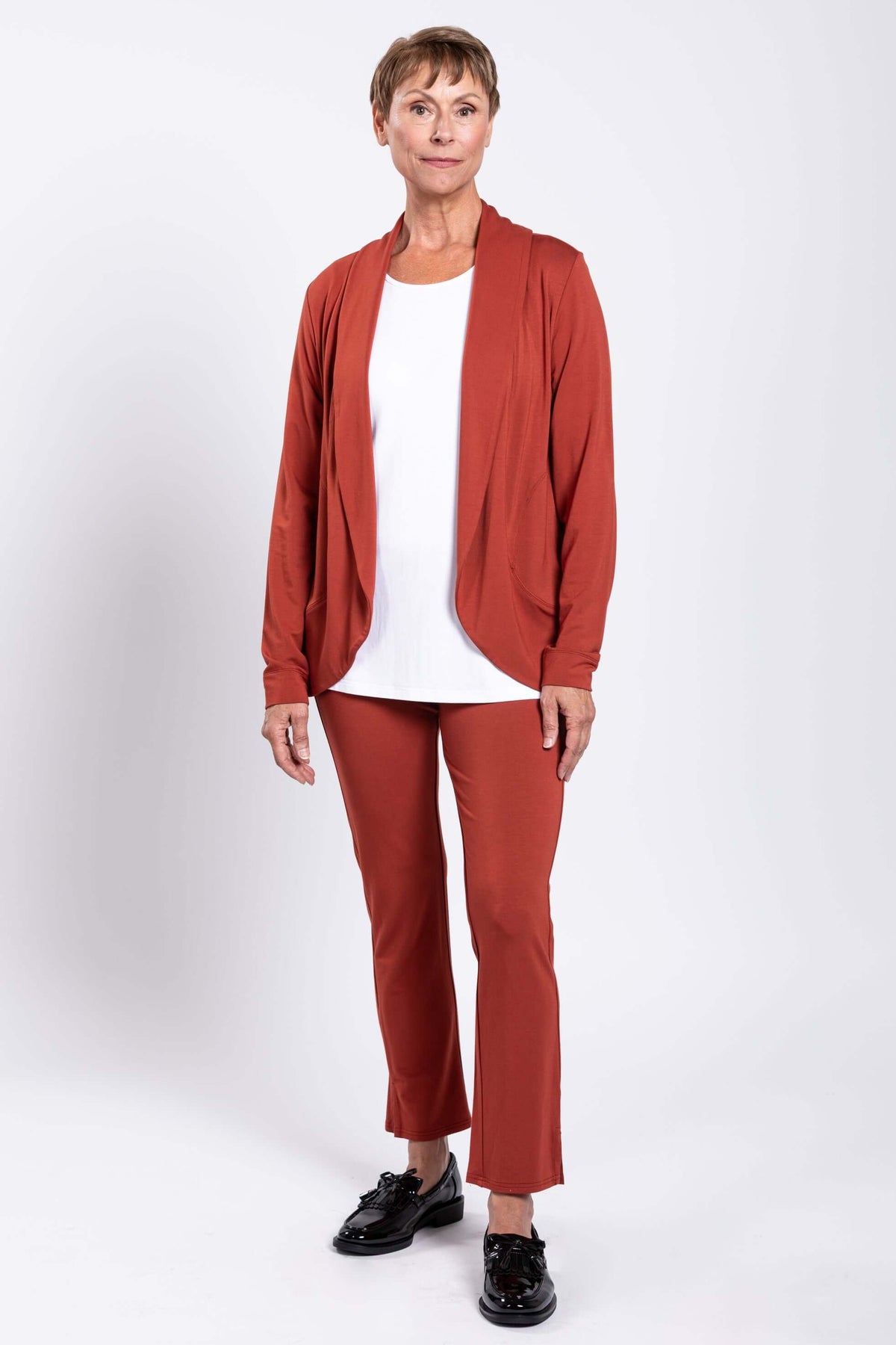 Model wearing full outfit with Sarina Bamboo Pant in rust and matching jacket