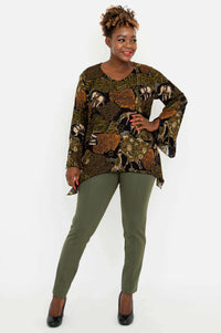 Model posing in Dorothy safari print top with hand on hip, front view