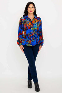 Woman wearing Linzy blouse standing with arms crossed in front