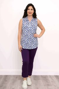 Model posing in The Hula sleeveless tank top in blue dotted pattern