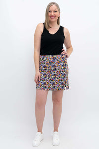 Woman modeling Melly Floral Skort with black tank top, smiling