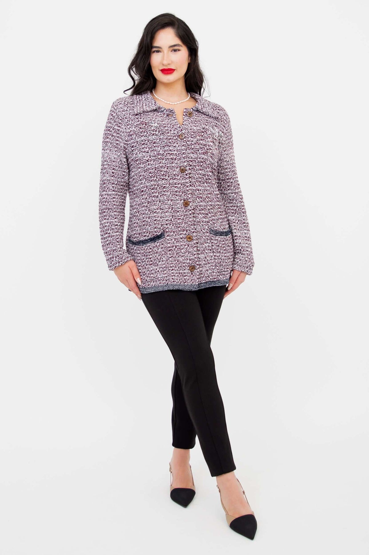 Model crossing one leg wearing Chanel Cardigan, front view, full outfit