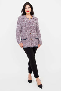 Model crossing one leg wearing Chanel Cardigan, front view, full outfit