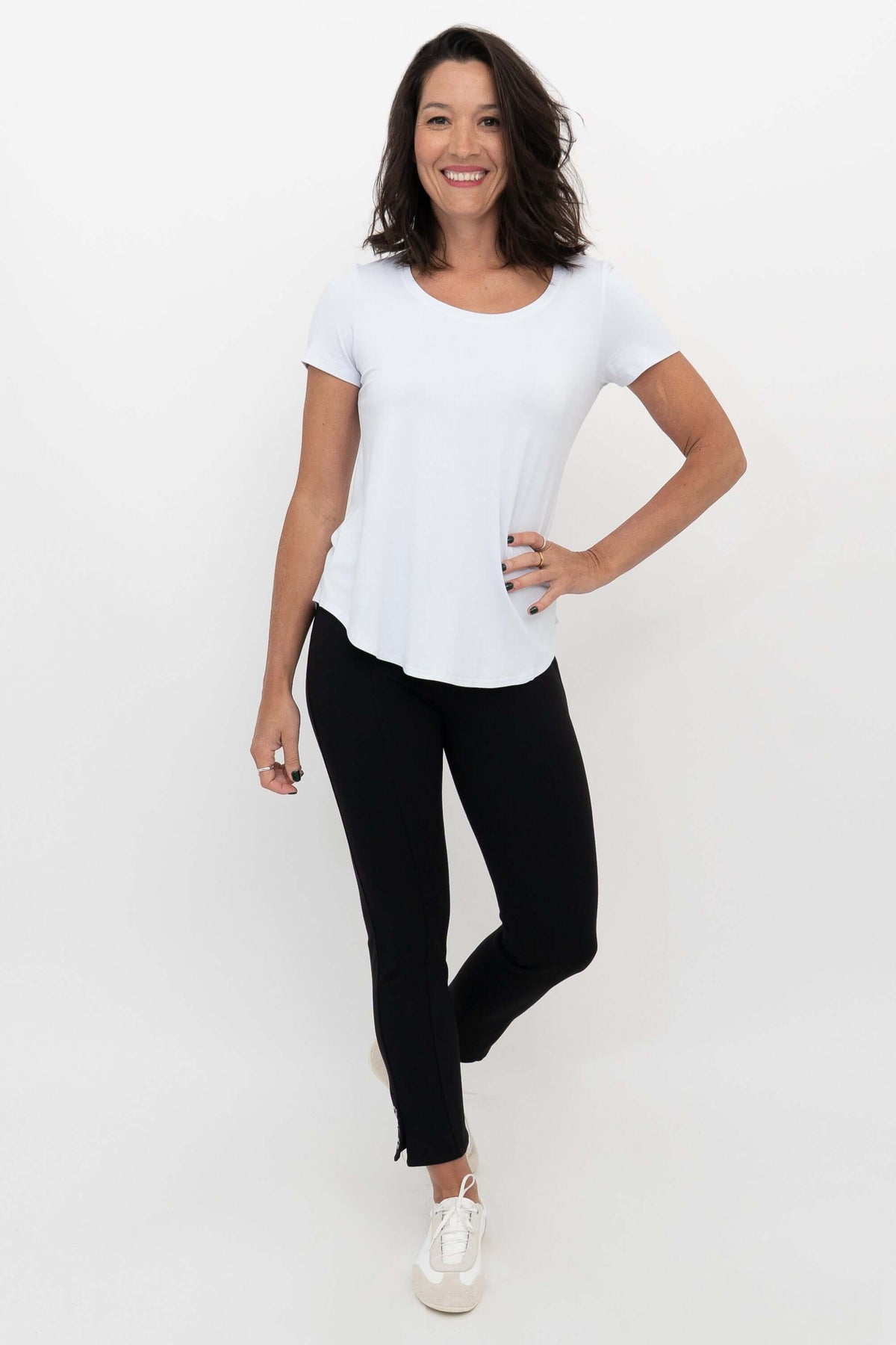 Model wearing the Nadine Crop Pant styled with a white T-shirt and white sneakers