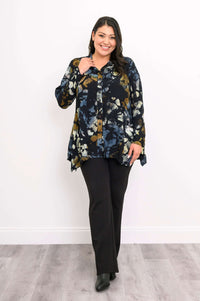 Model walking in Laney Blouse with midnight marble print, smiling