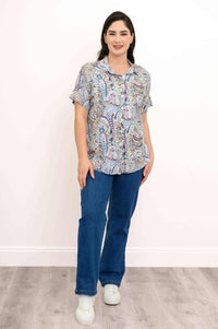 First model standing in Carolina Paisley Blouse and blue jeans, facing forward