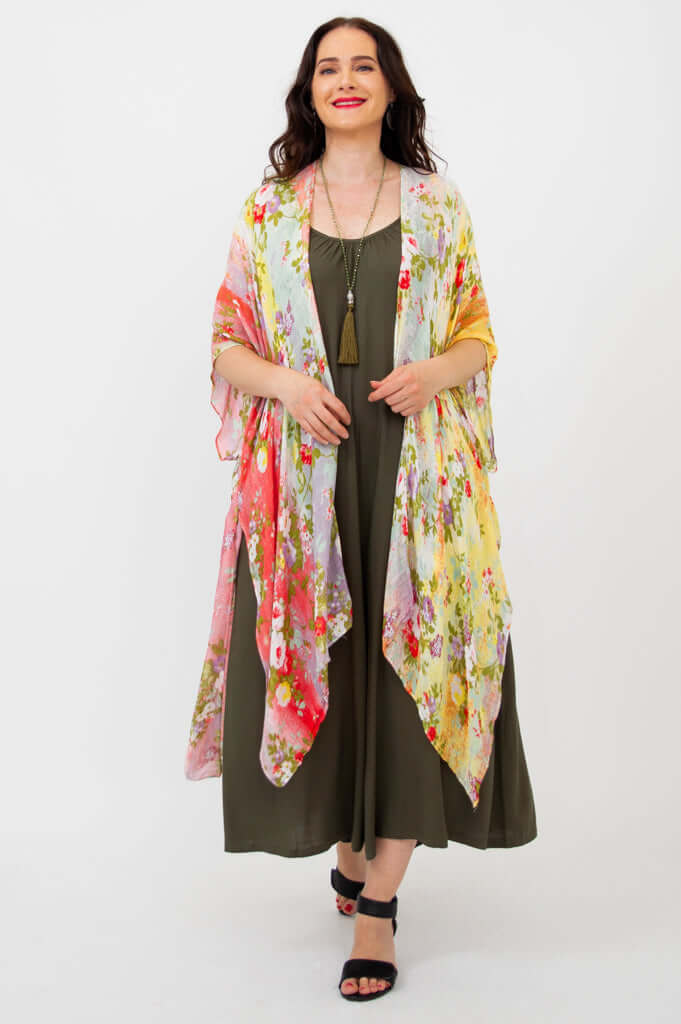 Model standing in floral Darcy kimono wrap, arms relaxed and smiling