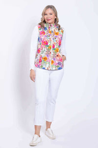 Three-quarter front view of woman modeling the Hartford Pink Print Vest and white pants